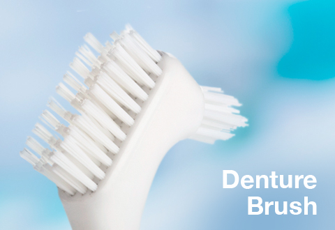 Use a denture brush to optimise your denture health and hygiene